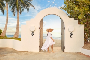 woman standing in an archway by the beach